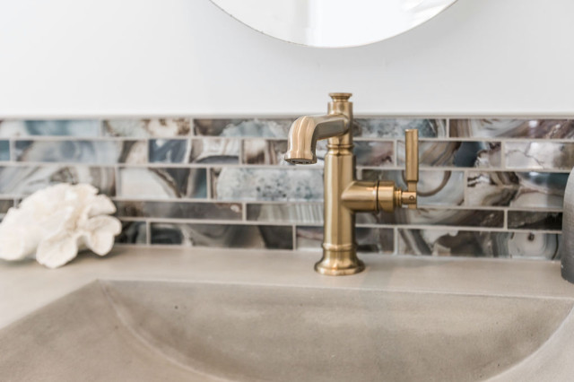 Brass Bathroom Faucet with Decorative Tile Backsplash in San Diego, CA coastal-powder-room