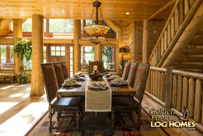 This is an example of a large country dining room in Other.