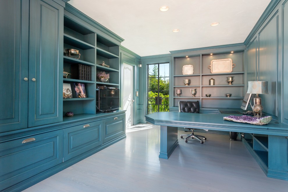 Design ideas for a beach style home office in Santa Barbara with a built-in desk.
