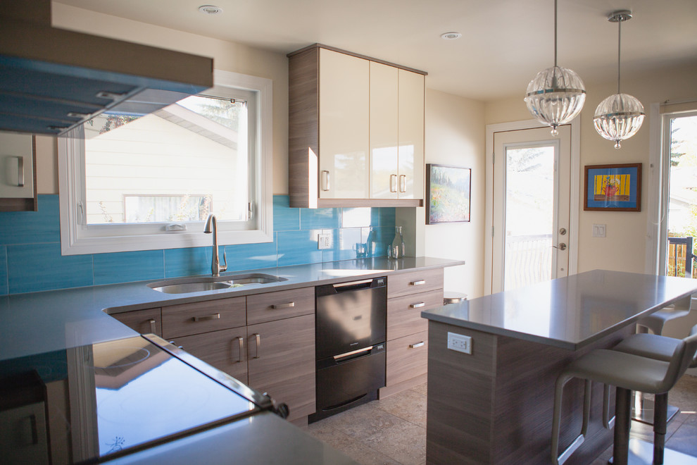 Mid-sized trendy l-shaped porcelain tile enclosed kitchen photo in Calgary with an undermount sink, flat-panel cabinets, white cabinets, quartz countertops, blue backsplash, ceramic backsplash, black appliances and an island
