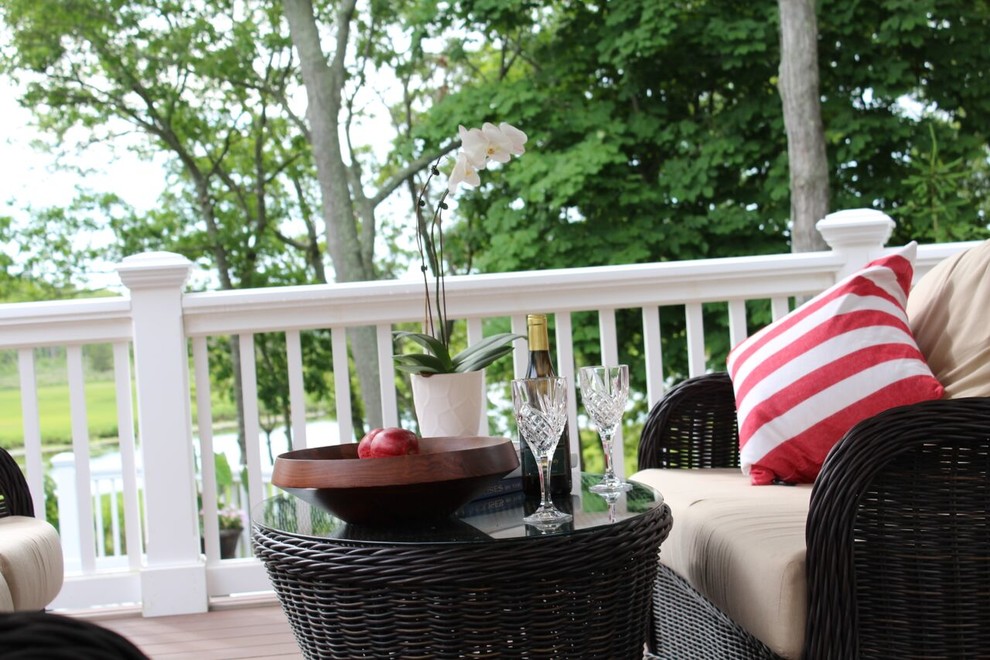 Example of a large classic backyard deck design with no cover