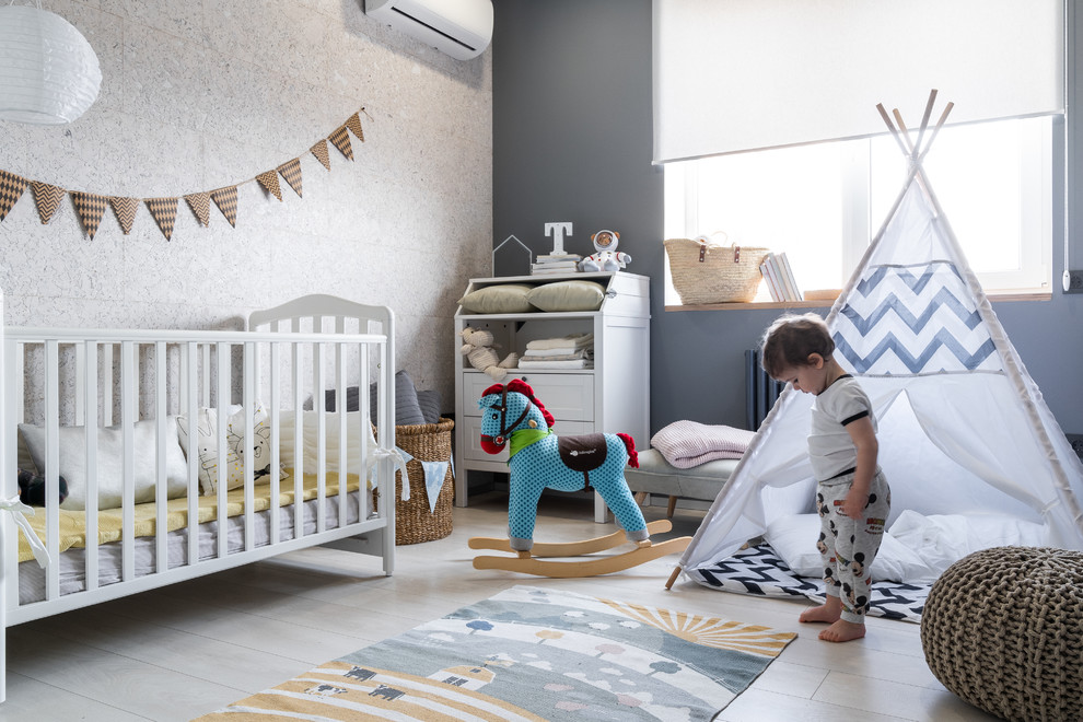 Mid-sized contemporary nursery in Other with grey walls, laminate floors and white floor for boys.