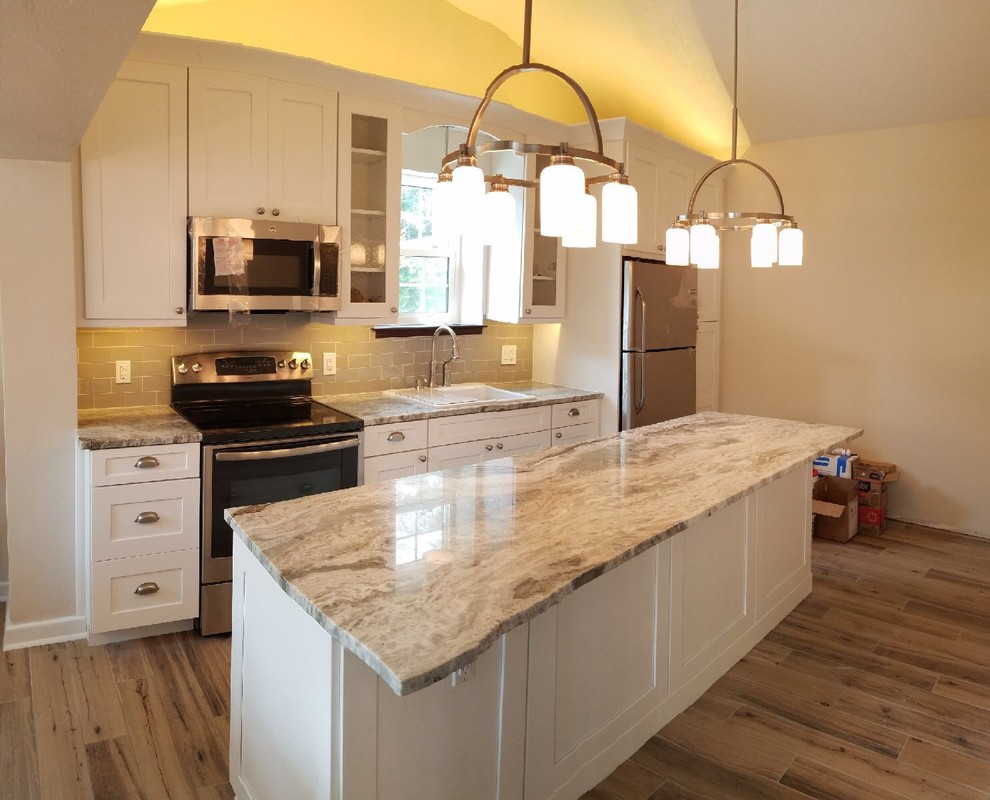 Example of a mid-sized transitional kitchen design in Miami