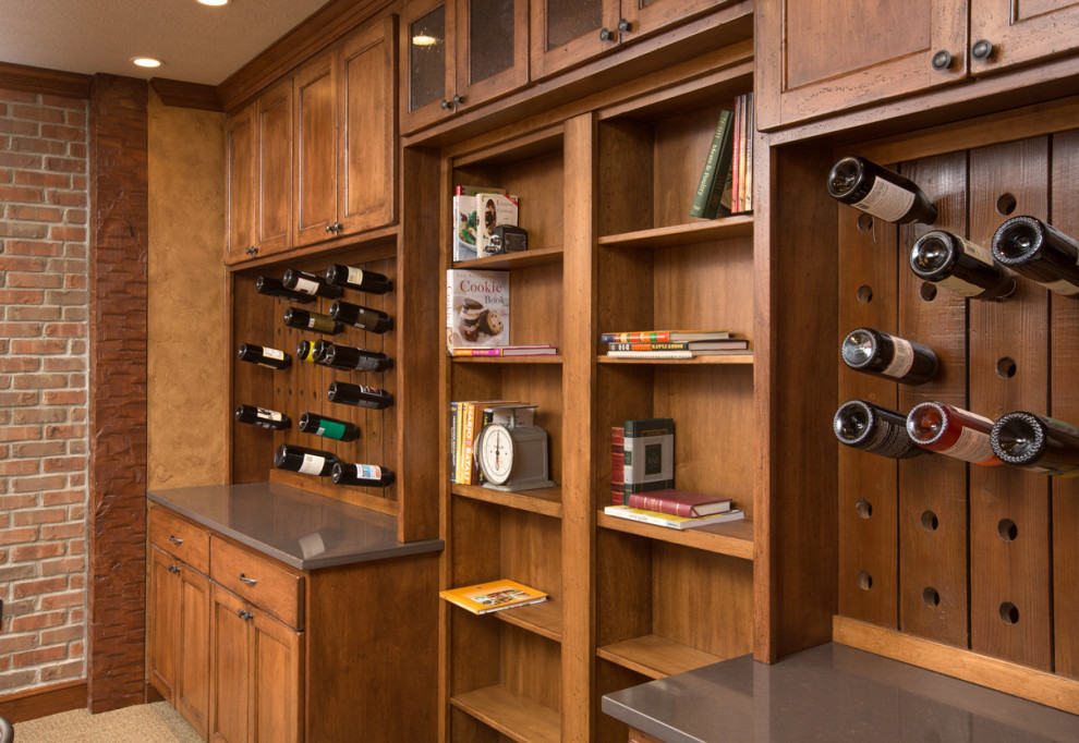 Design ideas for a large country single-wall home bar in Columbus with shaker cabinets, brown cabinets, quartz benchtops, brown splashback, shiplap splashback, carpet, beige floor and grey benchtop.