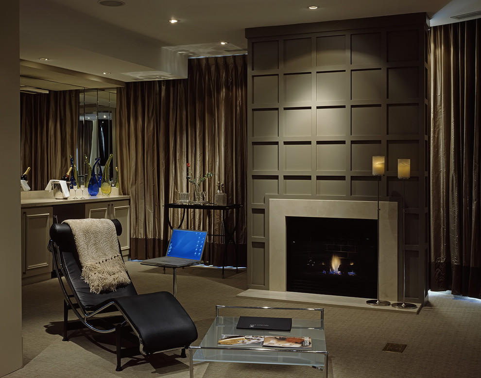 This is an example of a contemporary living room in Toronto with grey walls, a standard fireplace and a home bar.