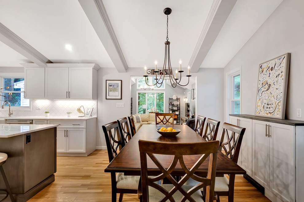 Transitional light wood floor eat-in kitchen photo in Boston with an island