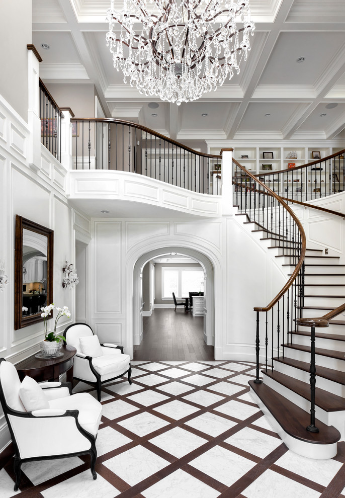 This is an example of a traditional foyer in Other with white walls and white floor.