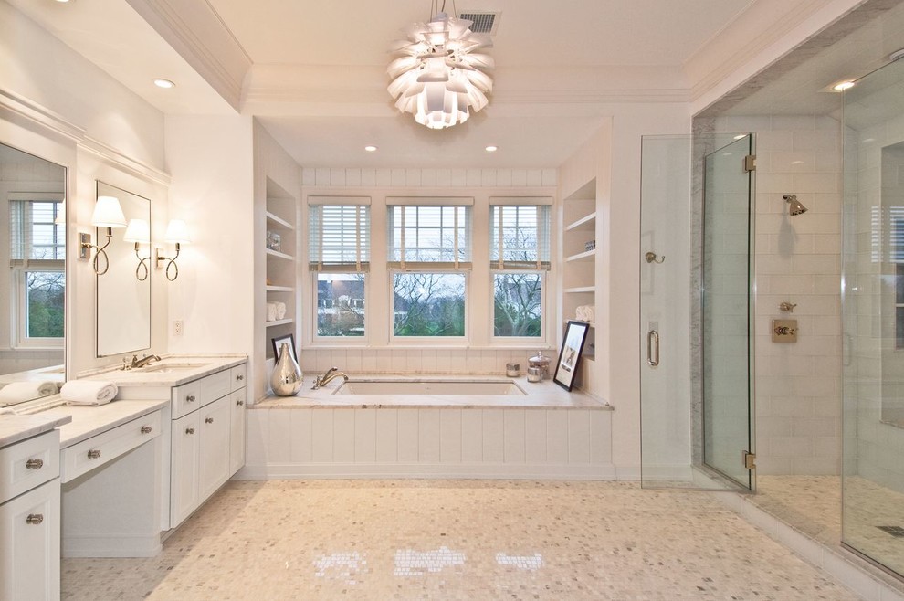 Inspiration for a large transitional master bathroom in Other with recessed-panel cabinets, white cabinets, an alcove tub, an alcove shower, white tile, ceramic tile, white walls, mosaic tile floors, an undermount sink, marble benchtops, multi-coloured floor and a hinged shower door.