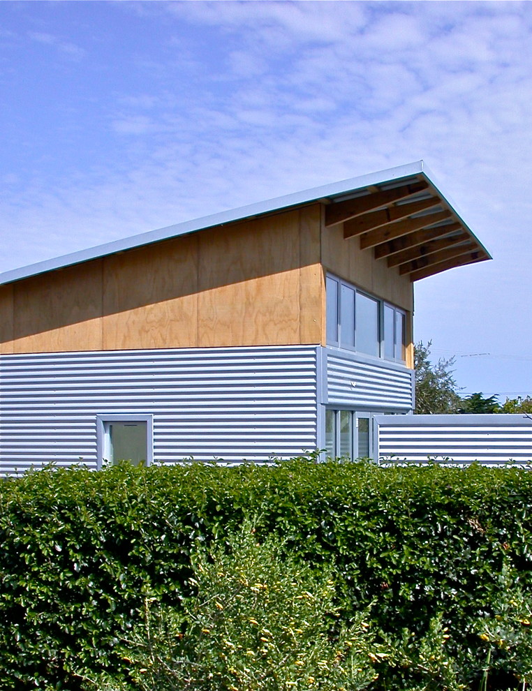Mid-sized contemporary one-storey exterior in Adelaide with metal siding.