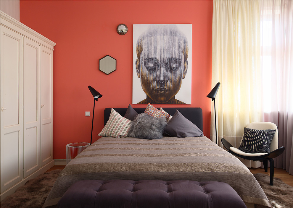 Design ideas for a contemporary bedroom in Moscow with orange walls.