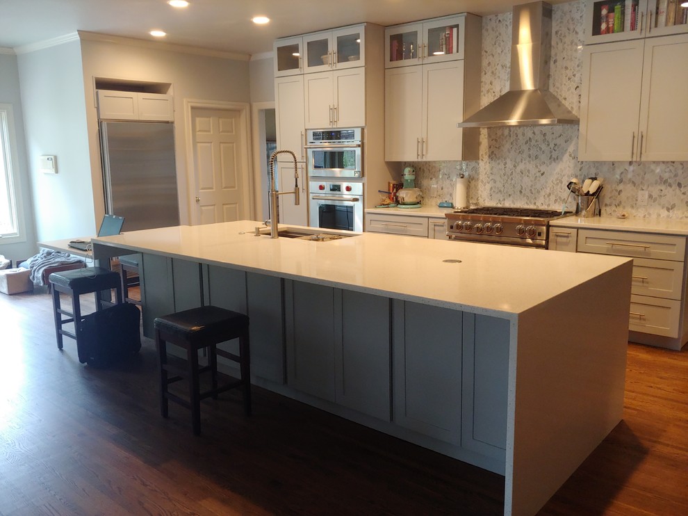 Inspiration for a large transitional single-wall light wood floor eat-in kitchen remodel with a single-bowl sink, shaker cabinets, gray cabinets, quartzite countertops, multicolored backsplash, mosaic tile backsplash, stainless steel appliances, an island and white countertops