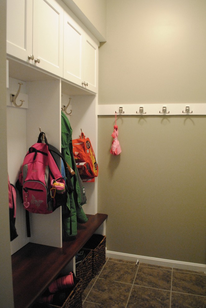 Design ideas for a traditional mudroom in DC Metro with beige walls.