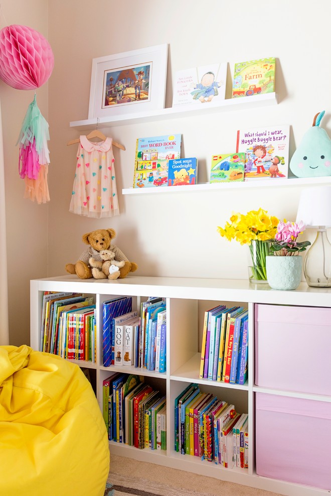 Small contemporary kids' room in Melbourne with beige walls and carpet for girls.