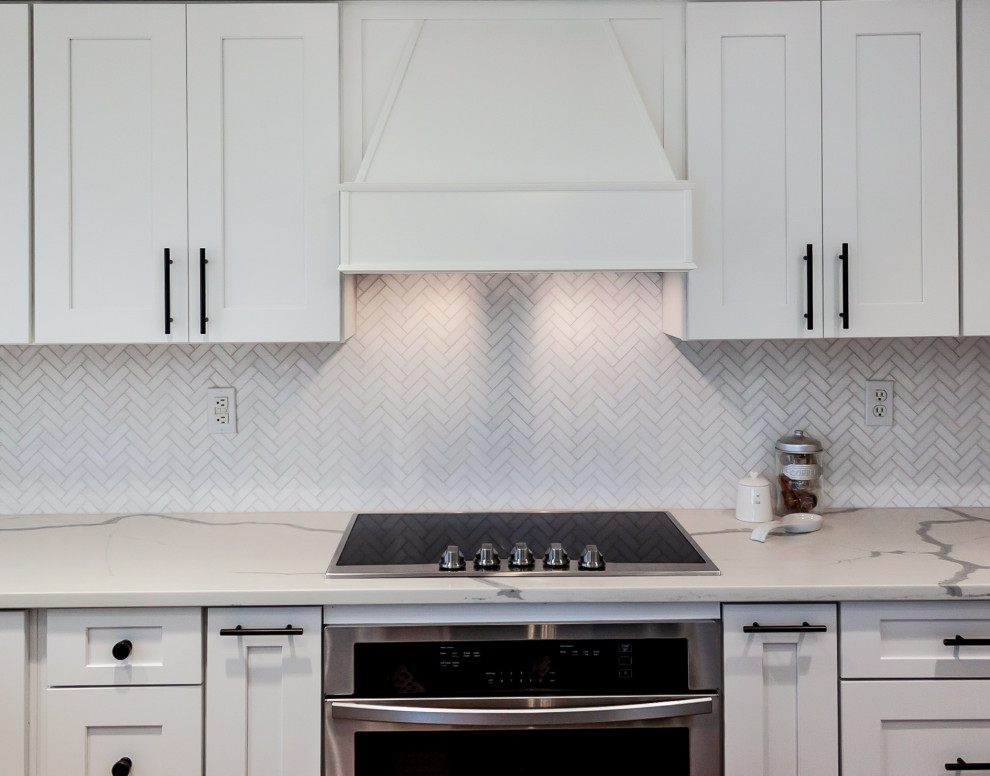 Example of a porcelain tile kitchen design in Phoenix with quartzite countertops