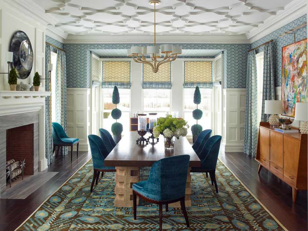 This is an example of a large traditional open plan dining in New York with blue walls, dark hardwood floors, a standard fireplace and a stone fireplace surround.