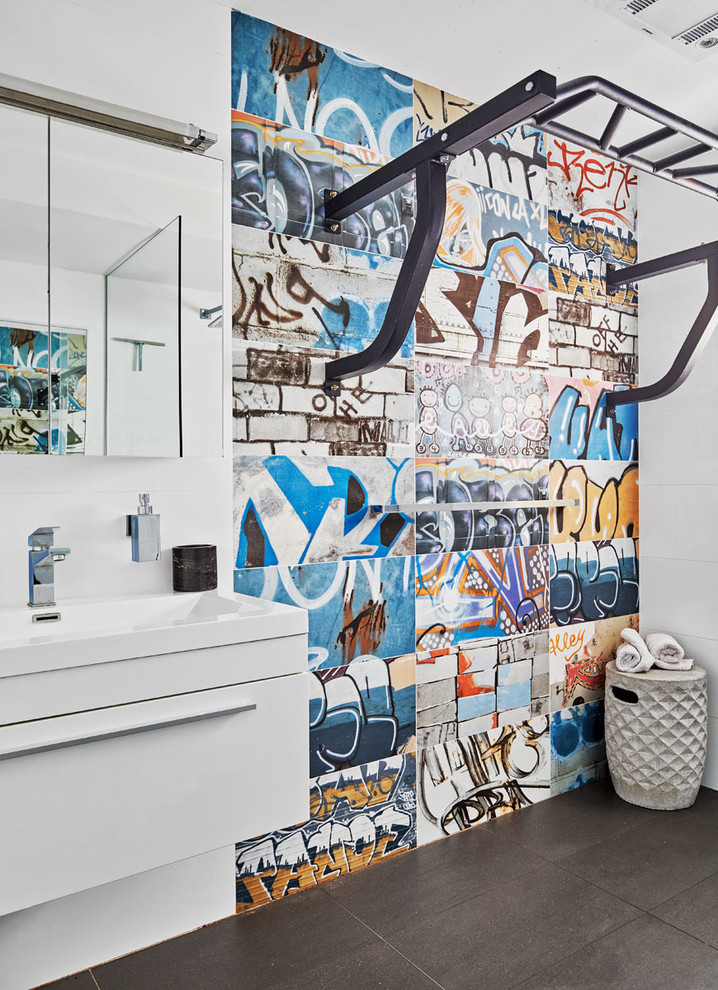 Design ideas for a small contemporary kids wet room bathroom in Sydney with white cabinets, white tile, multi-coloured tile, ceramic tile, white walls, ceramic floors, engineered quartz benchtops, grey floor, an open shower, flat-panel cabinets and a console sink.