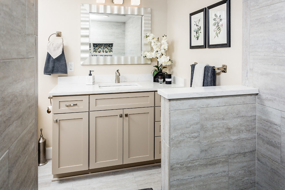Inspiration for a transitional bathroom remodel with shaker cabinets, white cabinets, beige walls, an undermount sink and quartz countertops
