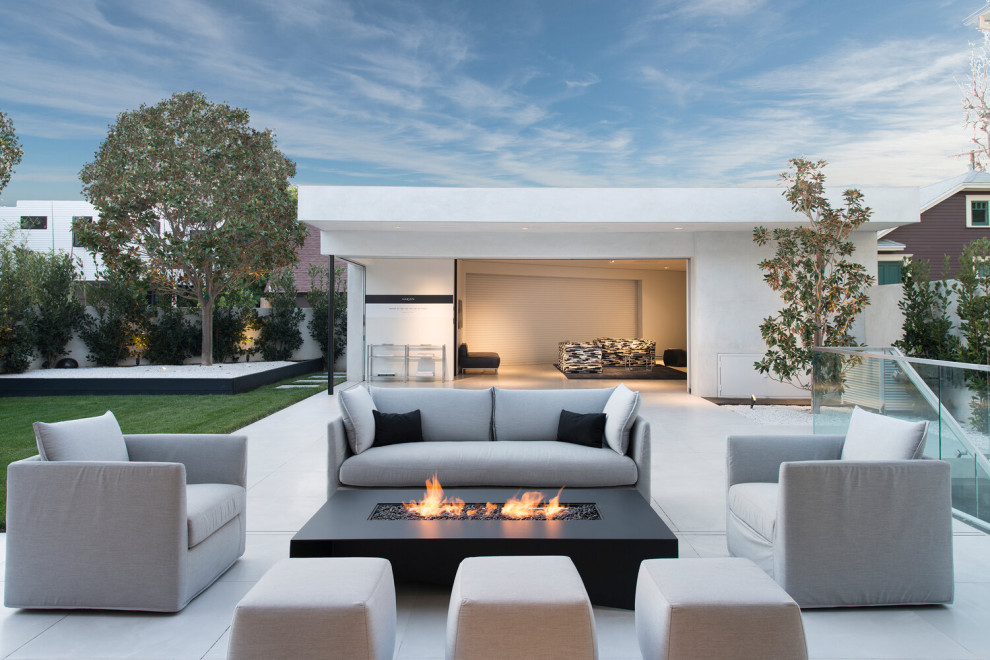 Design ideas for a small modern back patio in Los Angeles with a fire feature, tiled flooring and no cover.