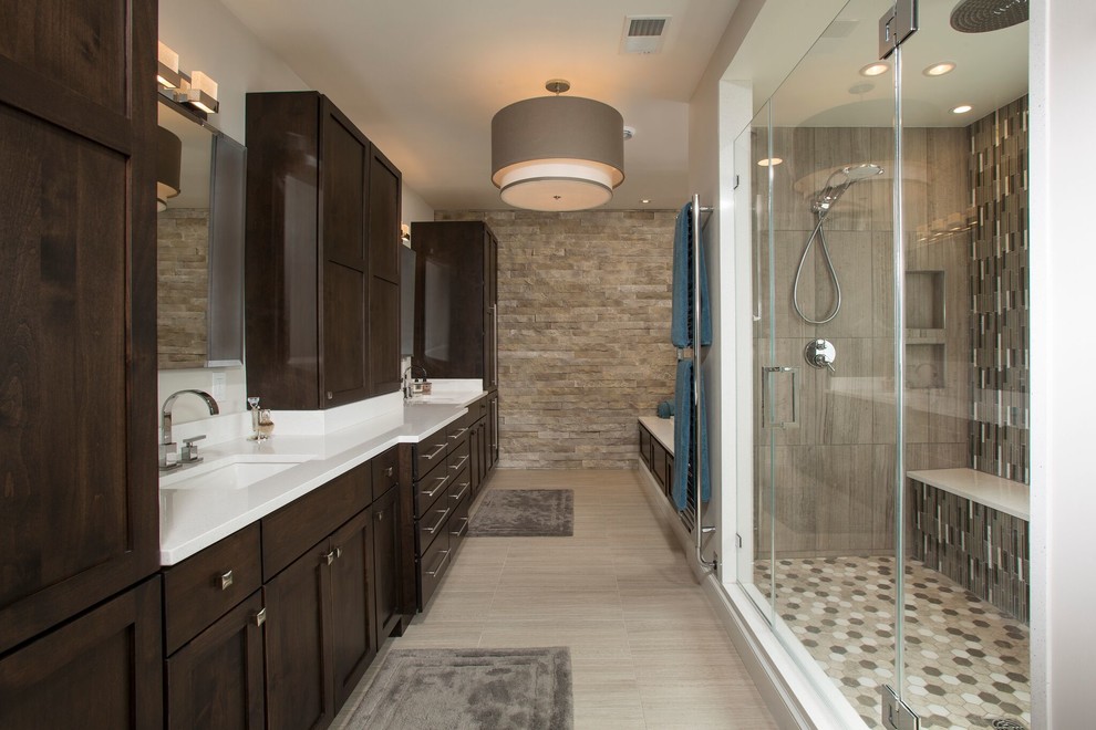 Inspiration for a transitional master bathroom in DC Metro with shaker cabinets, dark wood cabinets, an alcove tub, a double shower, gray tile, grey walls, an undermount sink, beige floor and a hinged shower door.