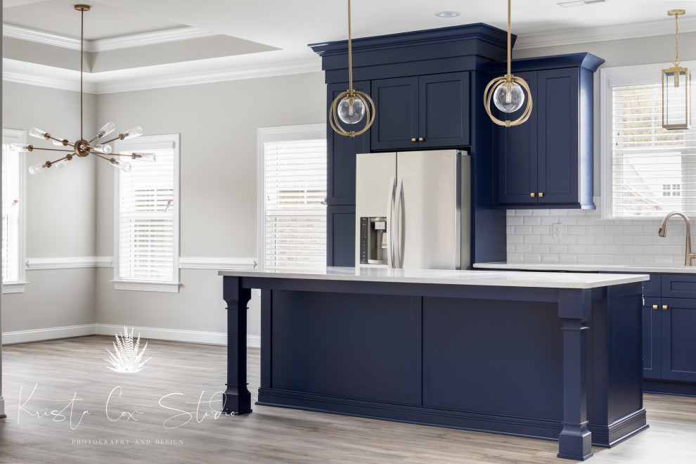 Kitchen - transitional kitchen idea with shaker cabinets, blue cabinets and an island