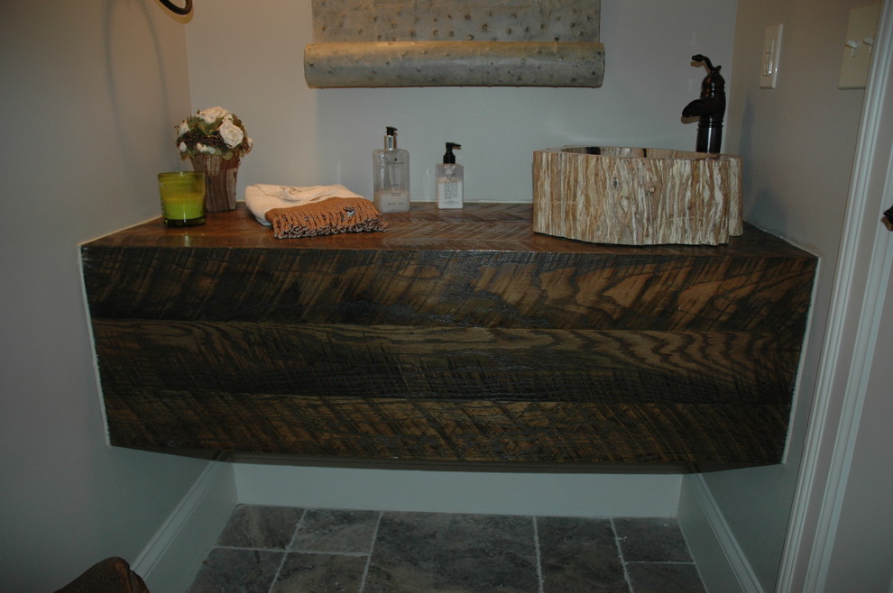 Inspiration for a small transitional 3/4 brown tile and stone tile porcelain tile bathroom remodel with a drop-in sink, open cabinets, dark wood cabinets, wood countertops, a two-piece toilet and beige walls