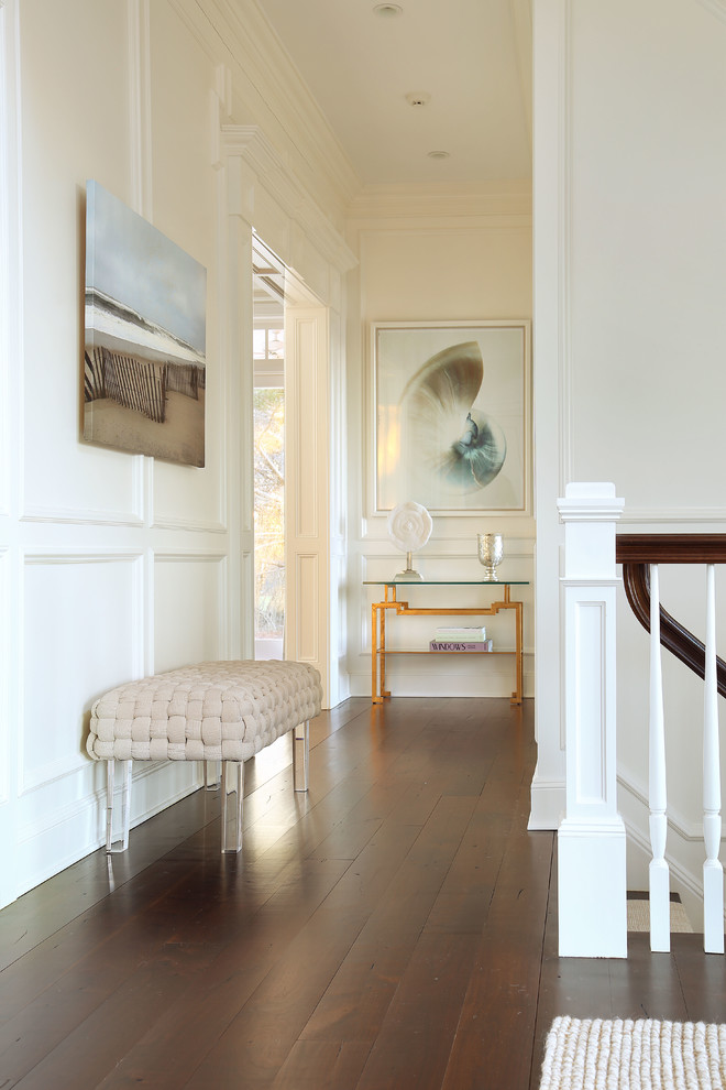 Design ideas for a transitional hallway in New York with white walls and dark hardwood floors.