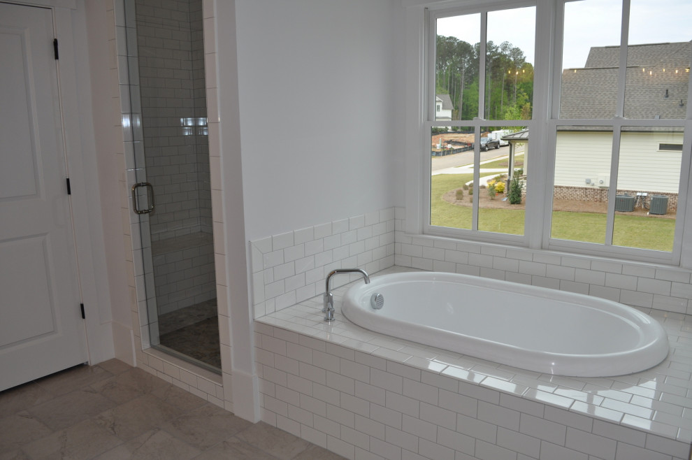 Design ideas for a mid-sized country master bathroom in Atlanta with a drop-in tub, an alcove shower, white walls, ceramic floors, grey floor and a hinged shower door.
