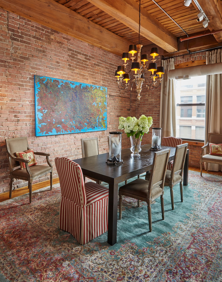 Photo of an eclectic dining room in Chicago with medium hardwood floors.