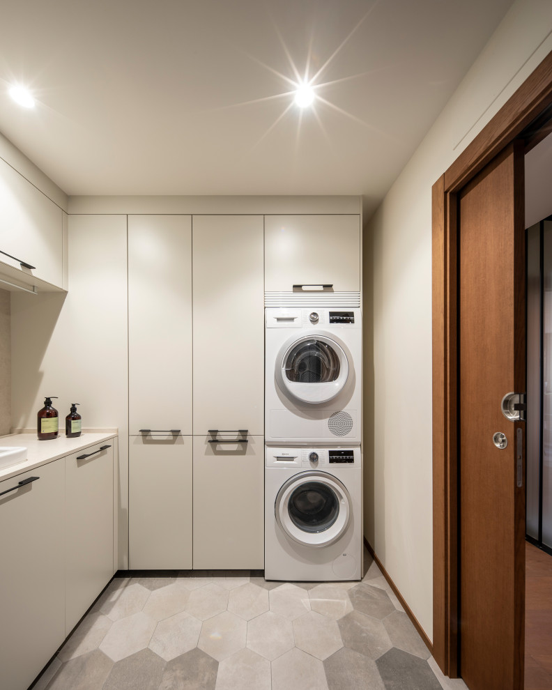 Design ideas for a transitional laundry room in Other.