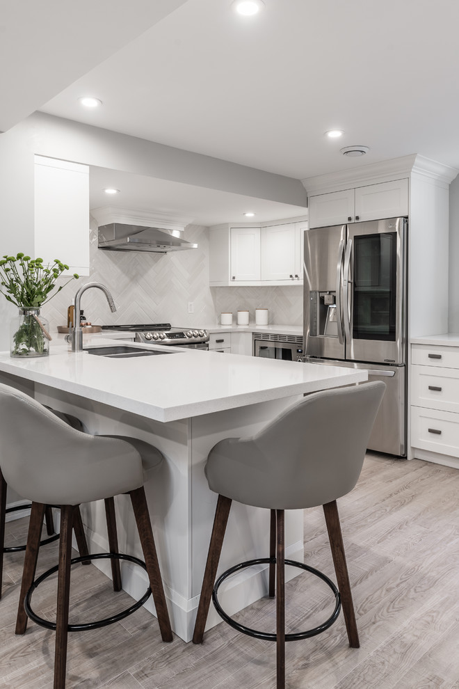 Example of a transitional kitchen design in Toronto