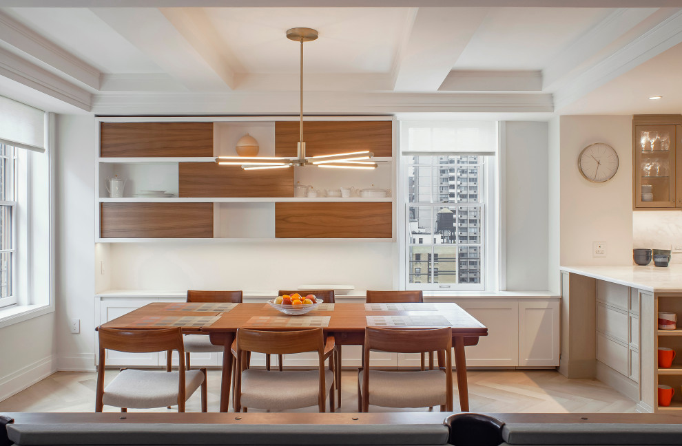 New York City Combination-Renovatin - Beautiful open dining room with custom floating wood shelves, a mid-century modern table, and a gorgeous brass pendant over the table.  
New clear finished herringbone floors and cabinets throughout.  White custom base cabinets.
Clean, modern window shades at pre-war windows with amazing views.
The original pre war beamed ceilings are preserved.