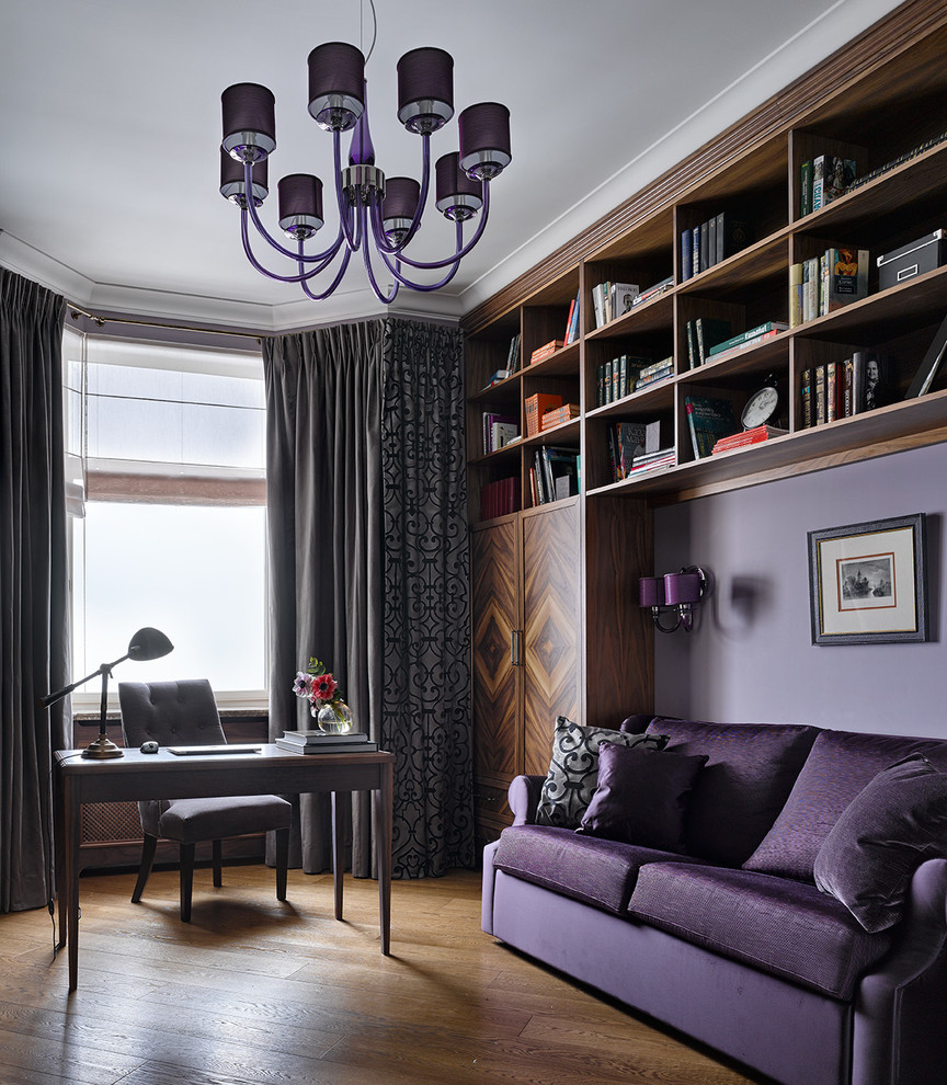 Inspiration for a traditional study room in Moscow with purple walls, medium hardwood floors and a freestanding desk.