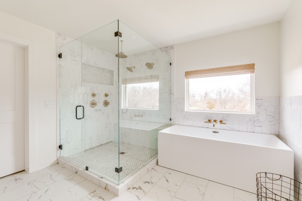 Photo of a large transitional master bathroom in Oklahoma City with light wood cabinets, a freestanding tub, a double shower, white tile, porcelain tile, porcelain floors, white floor, a hinged shower door, white benchtops, a shower seat and a double vanity.