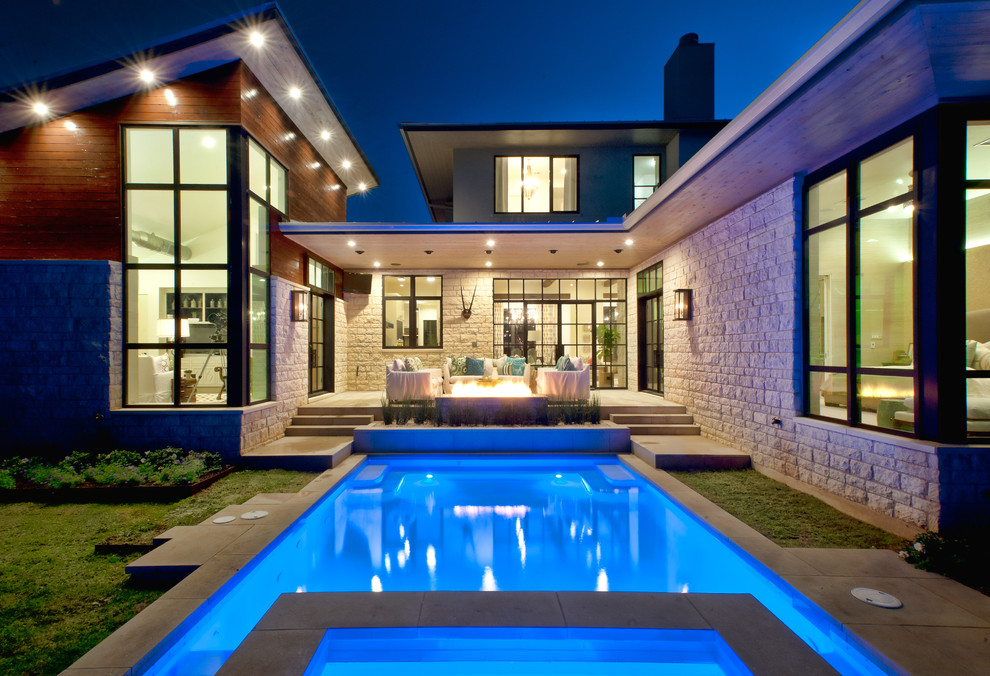 Photo of a contemporary backyard rectangular pool in Austin.