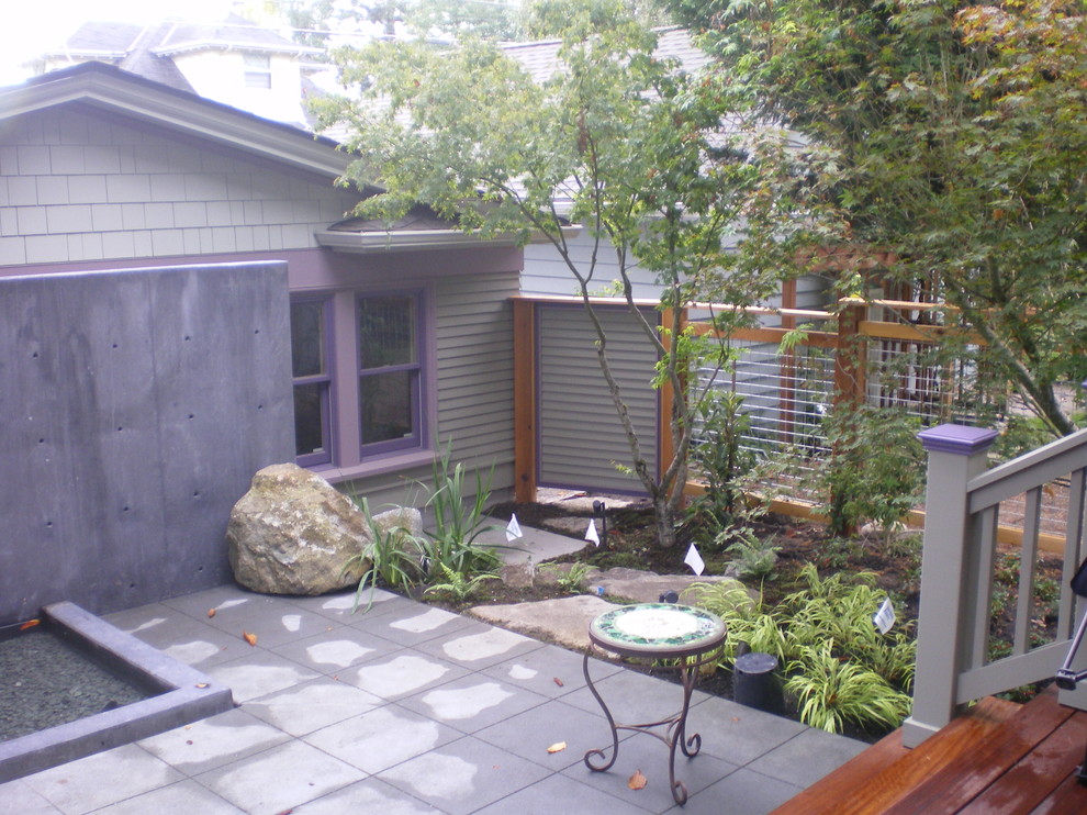 Inspiration for a mid-sized contemporary backyard patio in Seattle with concrete pavers and no cover.