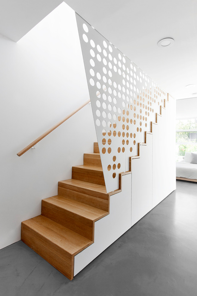 Inspiration for a scandinavian staircase in Vancouver with metal railing.