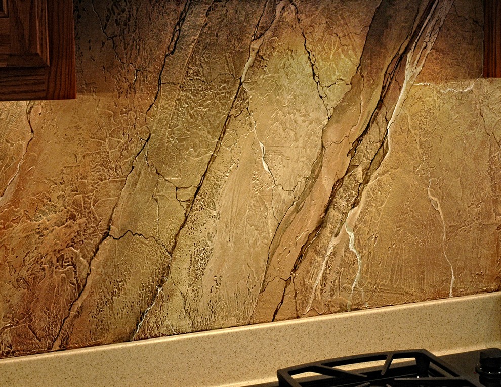 Example of a mid-sized classic u-shaped kitchen design in Phoenix with multicolored backsplash, black appliances and an island