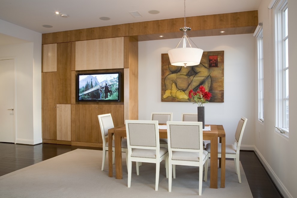 Photo of a contemporary dining room in DC Metro with white walls and dark hardwood floors.
