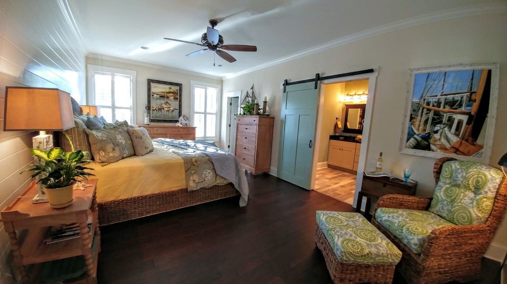 This is an example of an expansive arts and crafts master bedroom in Other with beige walls and dark hardwood floors.