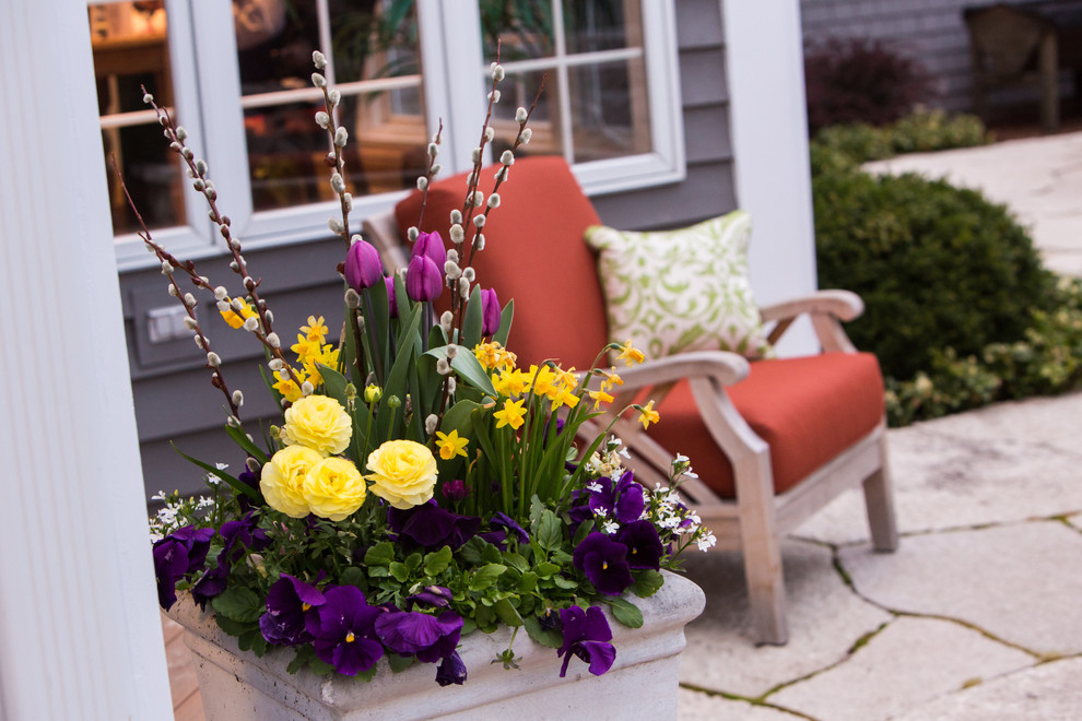 Design ideas for a large transitional partial sun backyard stone landscaping in Chicago for spring.