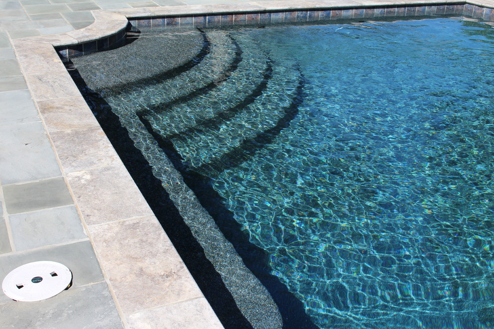 Design ideas for a large traditional backyard rectangular pool in Atlanta with a pool house.