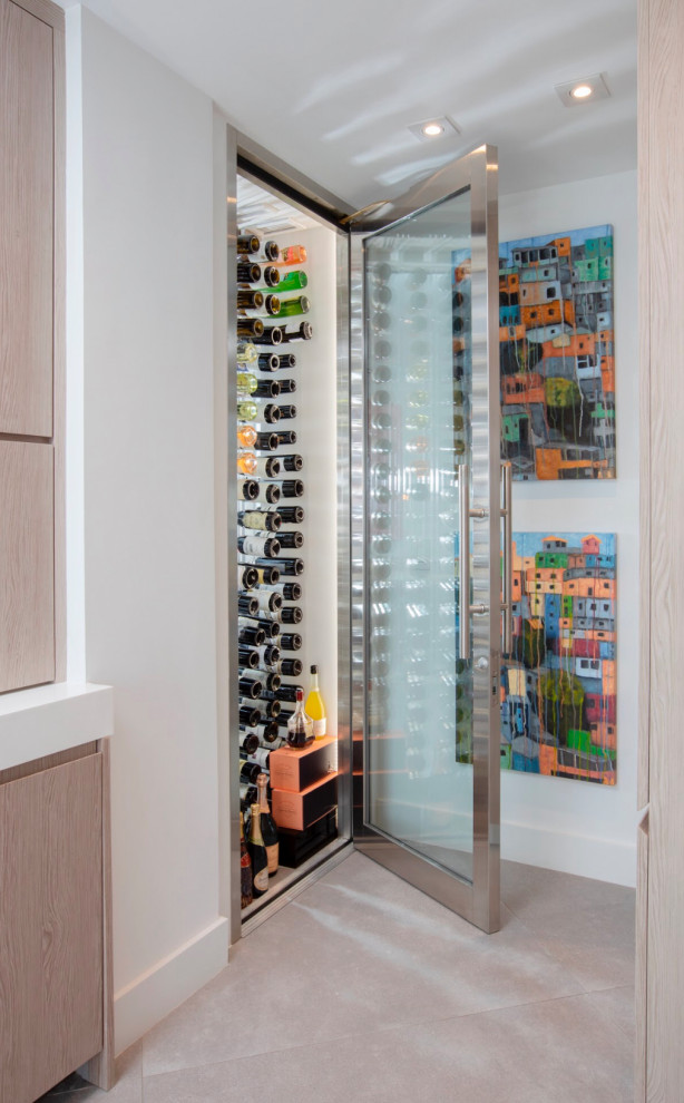 This is an example of a mid-sized contemporary wine cellar in Miami with porcelain floors and grey floor.