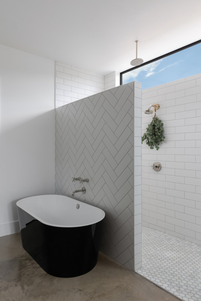 This is an example of a mid-sized scandinavian master bathroom in Austin with shaker cabinets, medium wood cabinets, a freestanding tub, a double shower, yellow tile, ceramic tile, white walls, concrete floors, an undermount sink, engineered quartz benchtops, beige floor, white benchtops, a double vanity and a built-in vanity.