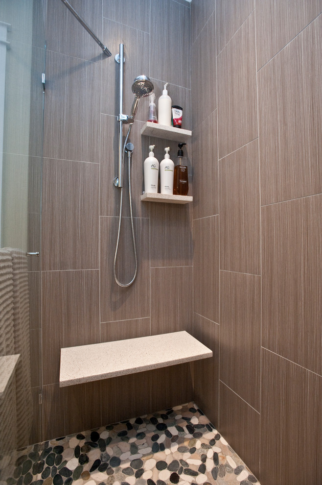 Large transitional master gray tile and ceramic tile ceramic tile drop-in bathtub photo with an undermount sink, shaker cabinets, brown cabinets, quartz countertops and gray walls