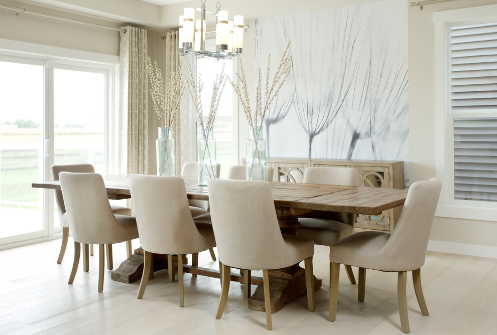 Example of a transitional light wood floor dining room design in Edmonton with beige walls