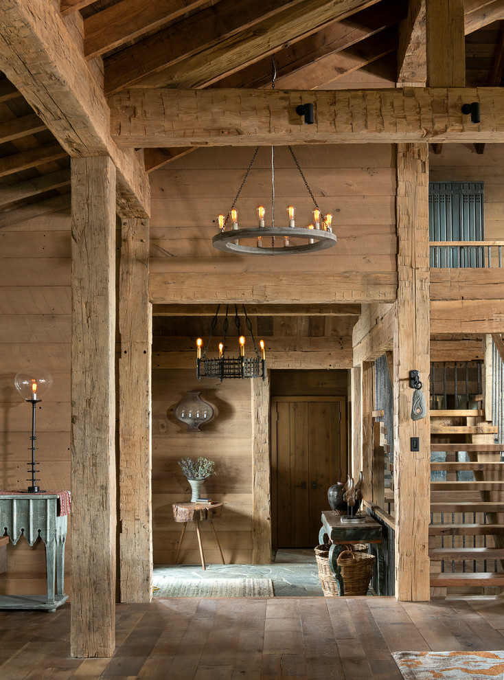 Inspiration for a large rustic entry hall remodel with brown walls