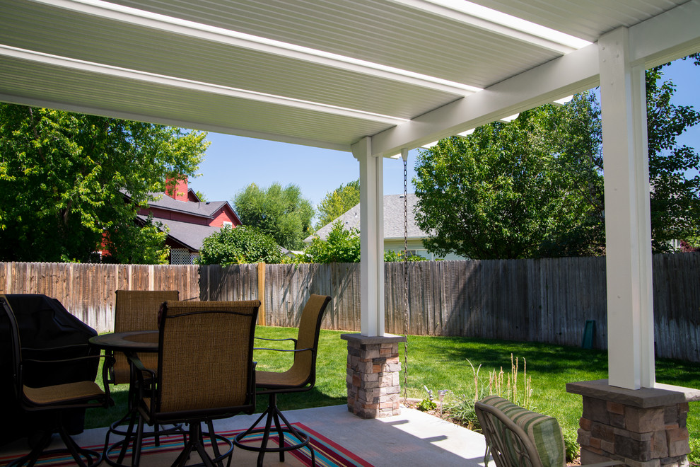 This is an example of a modern patio in Boise with an awning.