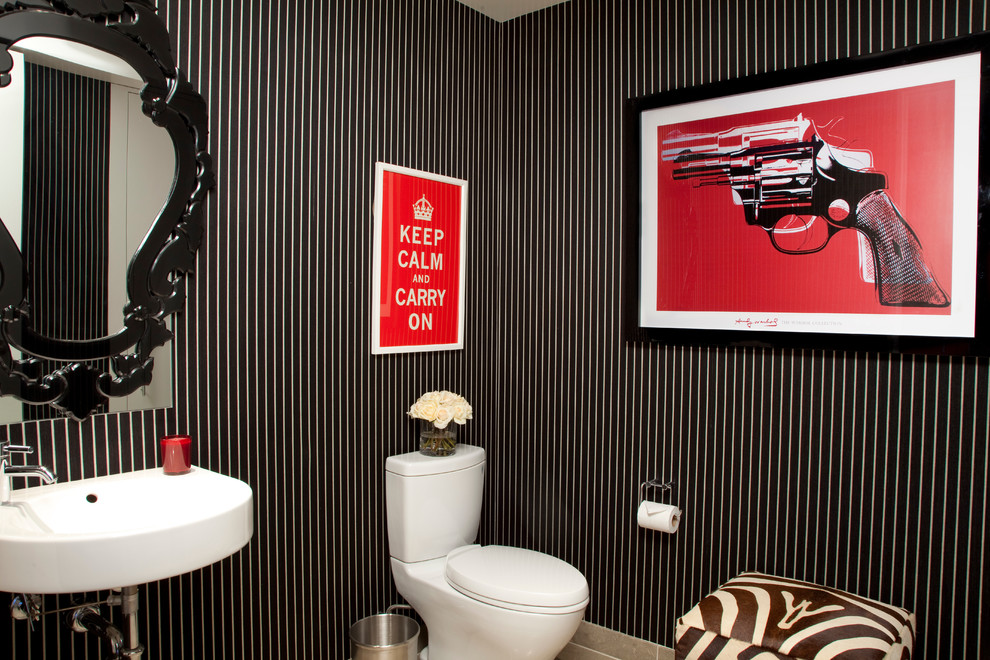 Photo of a mid-sized contemporary powder room in Los Angeles with a two-piece toilet and a wall-mount sink.