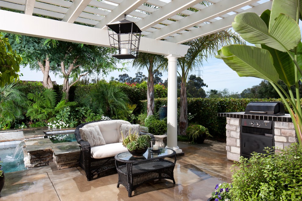 This is an example of a transitional patio in Other with a pergola.