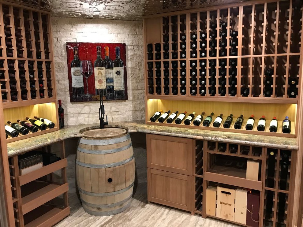 Mid-sized country wine cellar in Calgary with porcelain floors, storage racks and brown floor.
